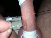 Man injecting his cock with needles